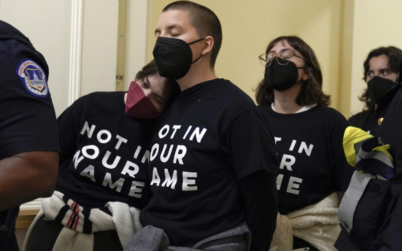 Demonstrators protest inside the Cannon House Office Building on Capitol Hill in Washington, Wednesday, Oct. 18, 2023. (AP Photo/Mariam Zuhaib)
