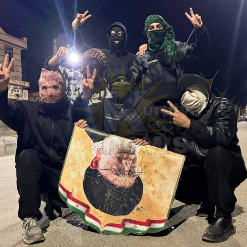 "Death To The Dictator: Uprising & Repression in Iran (with Anarchism Perspective" and a small picture of masked people posing with a torn-down poster of Khamenei