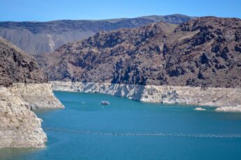 Low water levels are apparent on a bright blue lake.