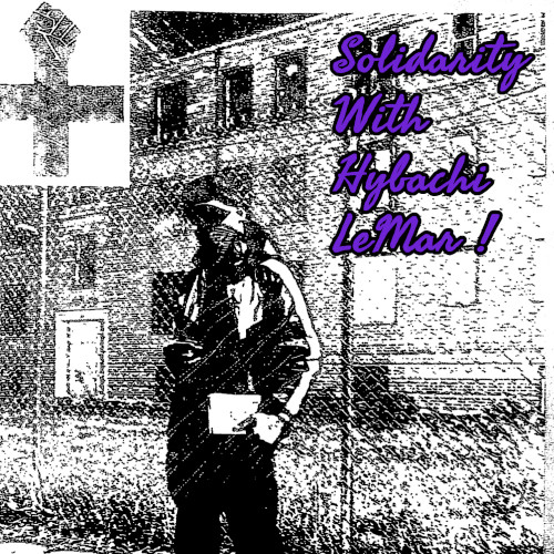 washed out black and white image of Hybachi in an adidas jumpsuit and mask holding lit in one hand, look at the camera from in front of a chainlink fence that divides foreground from a lawn and brick building in the bakcground. The image shows an anarchist black cross fist / cross, the words "Solidarity With Hybachi Lemar"
