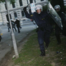 photo of police leading a baton charge