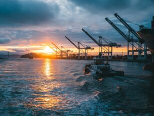 a boat moves through water along a port