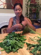 Aileen Suzara preparing taro leaves