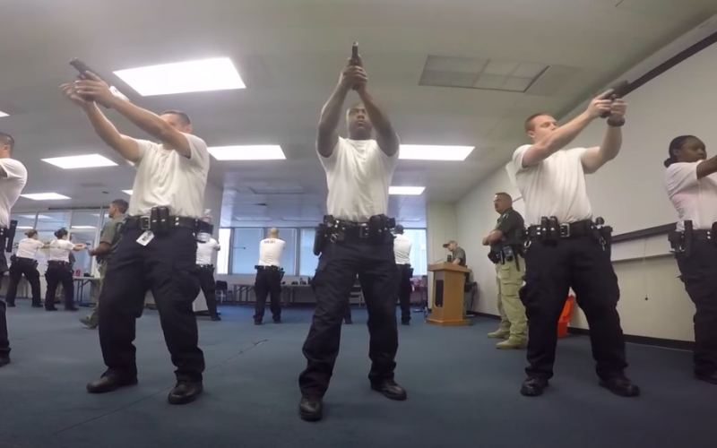 Oakland police trainees aim weapons in promotional video