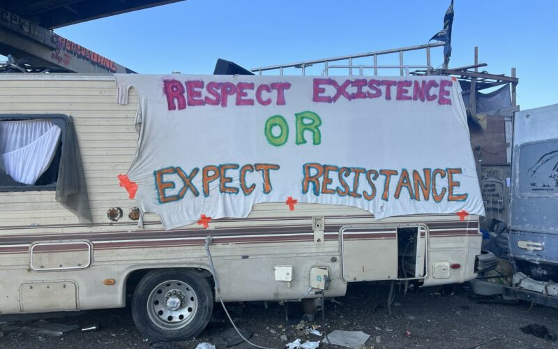 Trailer with a banner reading "Respect Existence or Expect Resistance"