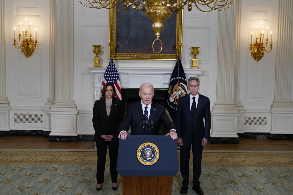 President Joe Biden, center, leaves with Secretary of State Antony Blinken, right, and Vice President Kamala Harris, left, after speaking Tuesday, Oct. 10, 2023, in the State Dining Room of the White House in Washington, about the war between Israel and the militant Palestinian group Hamas. (AP Photo/Evan Vucci)