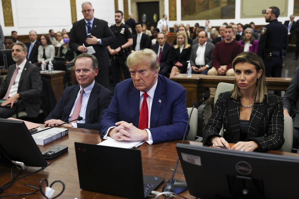 FILE - Former U.S. President Donald Trump, with lawyers Christopher Kise and Alina Habba, attends the closing arguments in the Trump Organization civil fraud trial at New York State Supreme Court in the Manhattan borough of New York, Jan. 11, 2024. Trump lawyers filed a notice of appeal Monday, Feb. 26, for his $454 million New York civil fraud judgment, challenging a judge’s finding that he lied about his wealth as he grew the real estate empire that launched him to stardom and the presidency. (Shannon Stapleton/Pool Photo via AP, File)