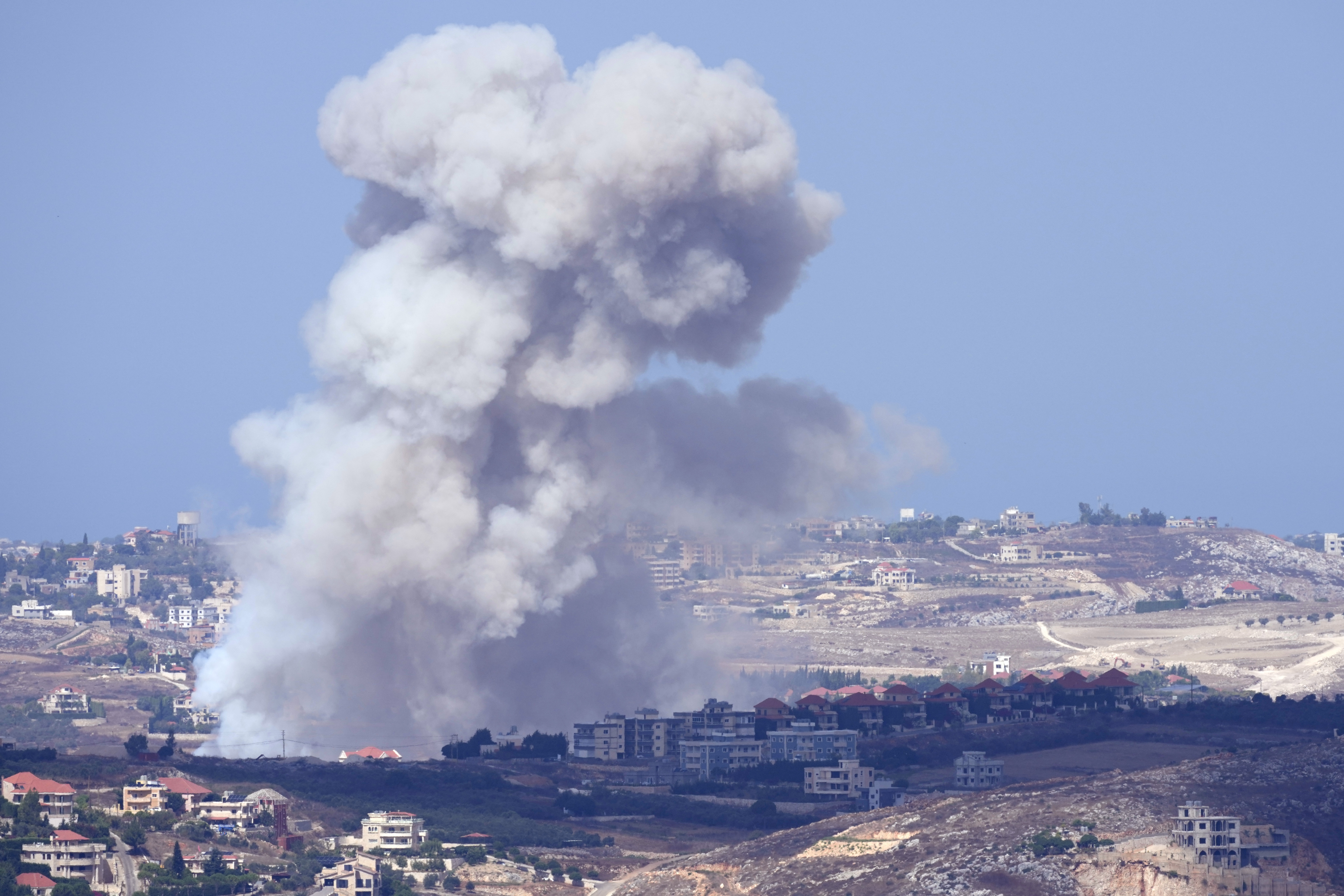 Smoke rises from Israeli airstrikes on villages in the Nabatiyeh district, seen from the southern town of Marjayoun, Lebanon, Monday, Sept. 23, 2024.(AP Photo/Hussein Malla)